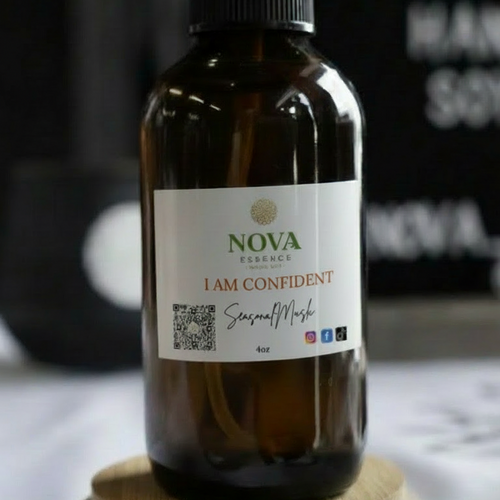 Bottle of 'I AM CONFIDENT' spray with a label on a wooden coaster.